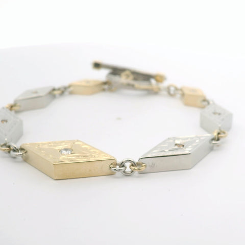 YELLOW GOLD AND PLATINUM REVERSIBLE DIAMOND MOKUME BRACELET WITH TOGGLE CLASP