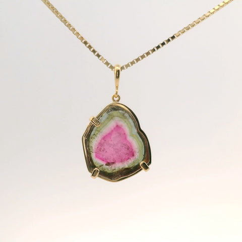 gold pendant featuring pink and green tourmaline stone, front view