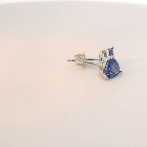 Earrings showing triangle blue stones from a side view