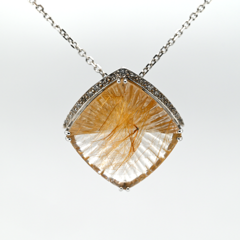 21.14CT RUTILATED QUARTZ AND DIAMOND PENDANT