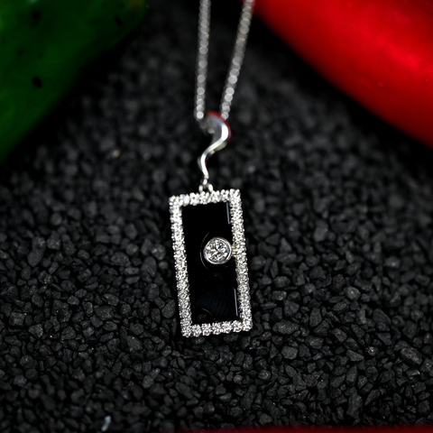 .35CTW NATURAL DIAMOND AND ONXY PENDANT