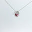 Necklace with a pink gemstone pendant viewed at a different angle