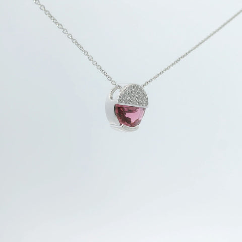 Necklace with a pink gemstone pendant viewed at a different angle