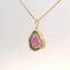 gold pendant showcasing pink and green tourmaline stone, angled view